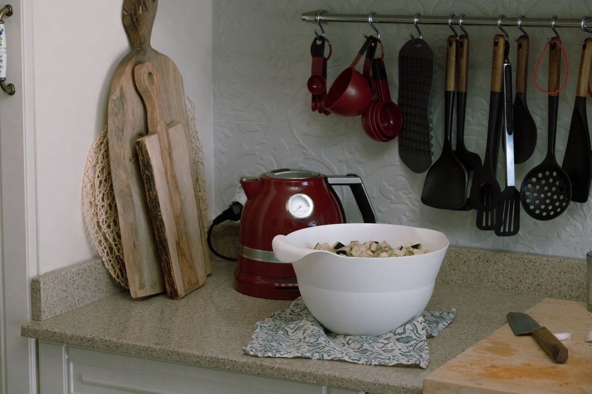 white ceramic pots and pans on a wooden counter